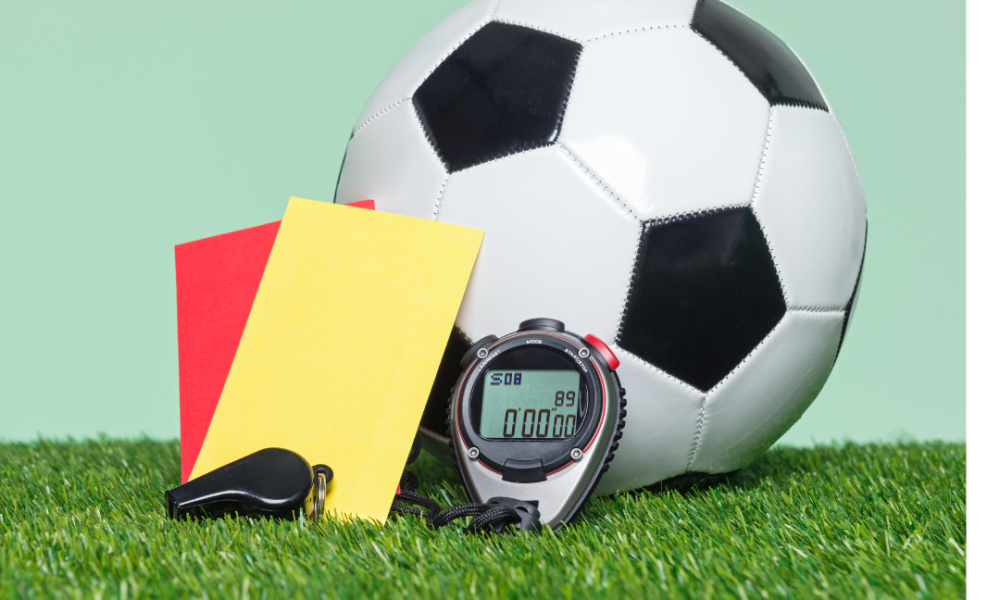 football, whistle, stopwatch and red and yellow cards