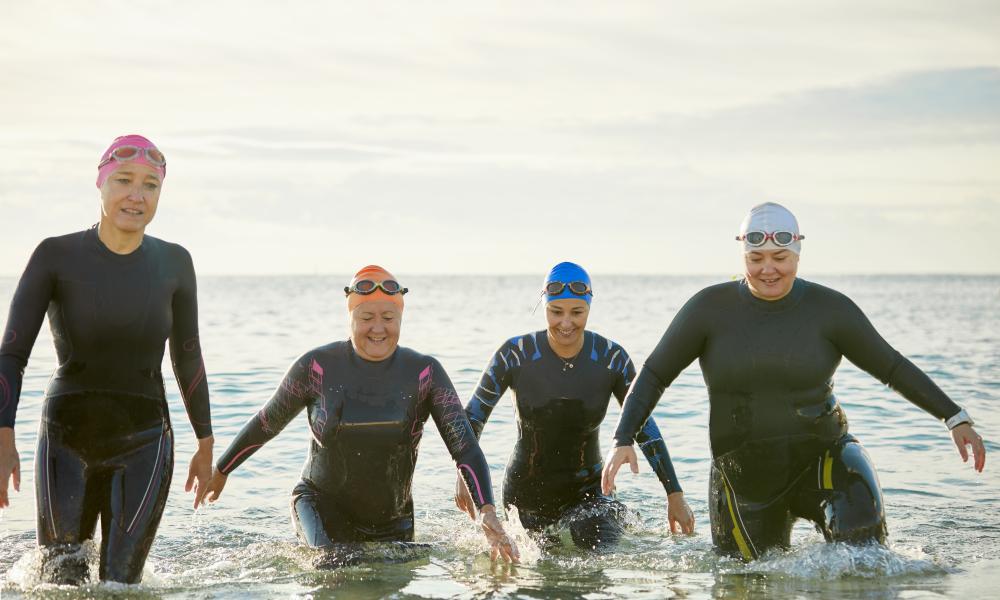 Four women coming out of the sea