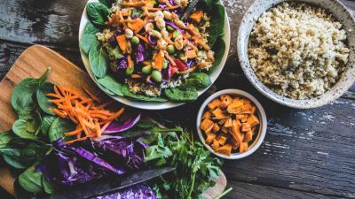 Healthy looking bowl of food including carrots, cabbage, salad leaves and quinoa. Healthy looking bowl of food including carrots, cabbage, salad leaves and quinoa.