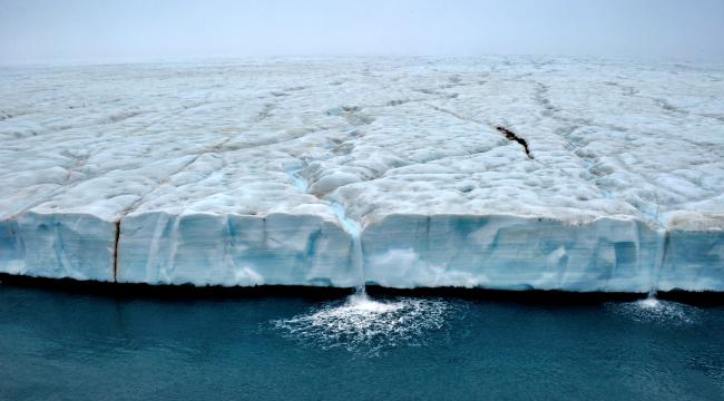 Waterfalls cascade from the Austfonna polar ice cap, Svalbard, Arctic. Andy Rousenna.jpg