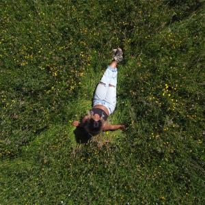 Lady in green field in the summer